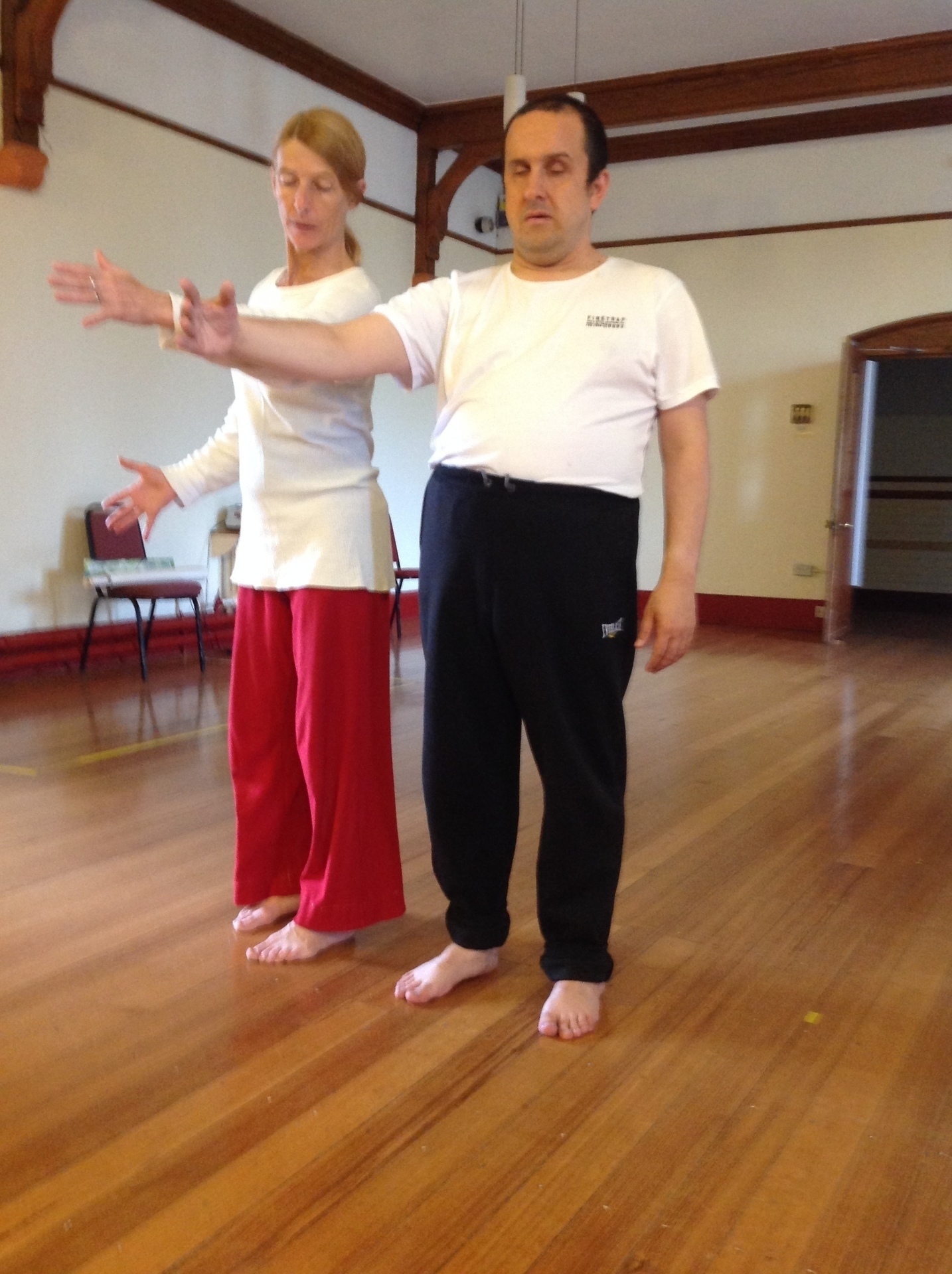 Photo of two people in counterbalance or arms open