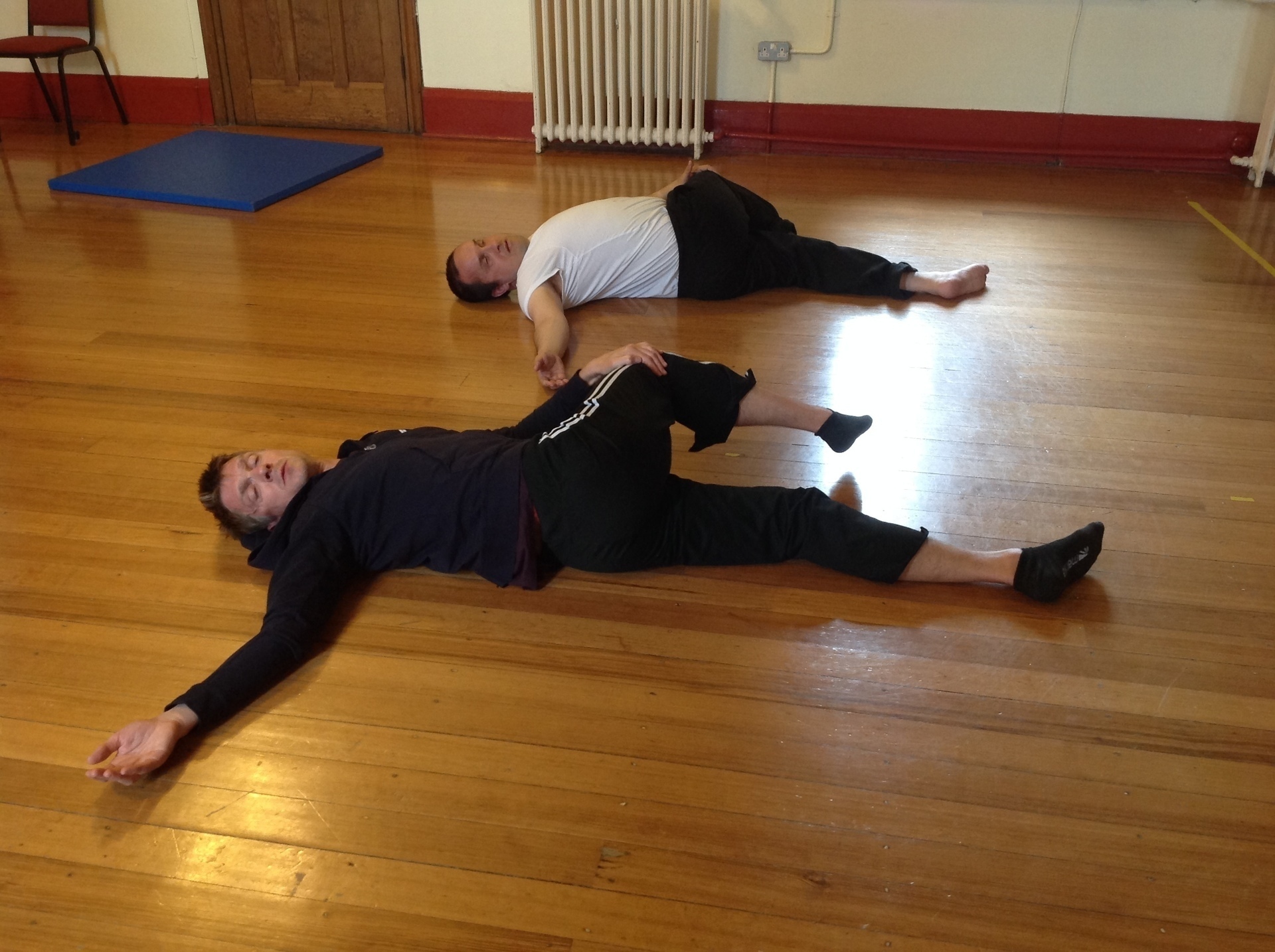 Photo of yoga stretch lying on back knee to chest